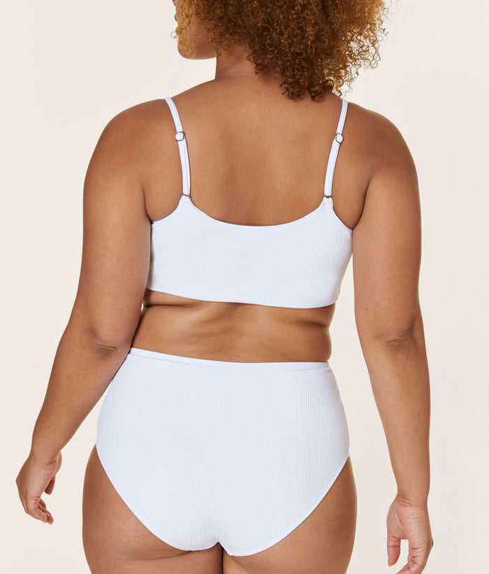 Andie Swim high-waisted ribbed white bikini bottom with full seat coverage, modeled from the back. Comfortable and compressive fit, offering fuller butt coverage