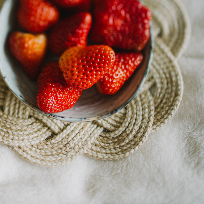 Handmade cotton trivet in a natural color under a bowl of strawberries | Home Decor Gifts