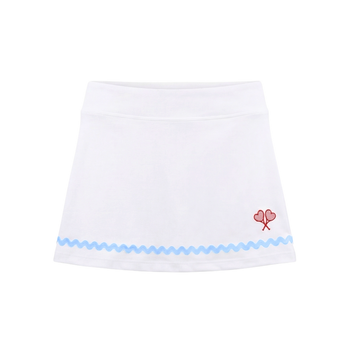 White skirt with blue trim and red floral design on a white background
