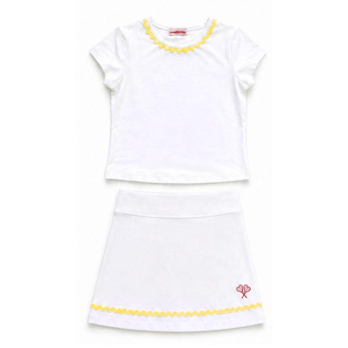 White top and skirt with yellow trim on a white background