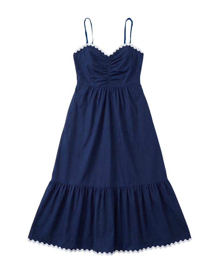 Navy blue dress with thin straps on a white background