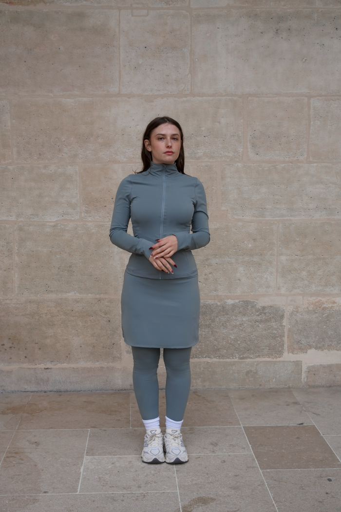 Front view of the 18-inch sage green modest sport skirt with integrated legging, perfect for Muslim women and modest activewear.