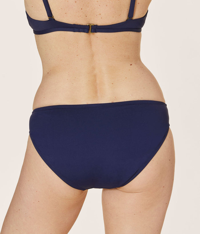 Andie Swim Bikini Bottom in Navy Eco Nylon, featuring a low rise design and medium seat coverage for a flattering fit