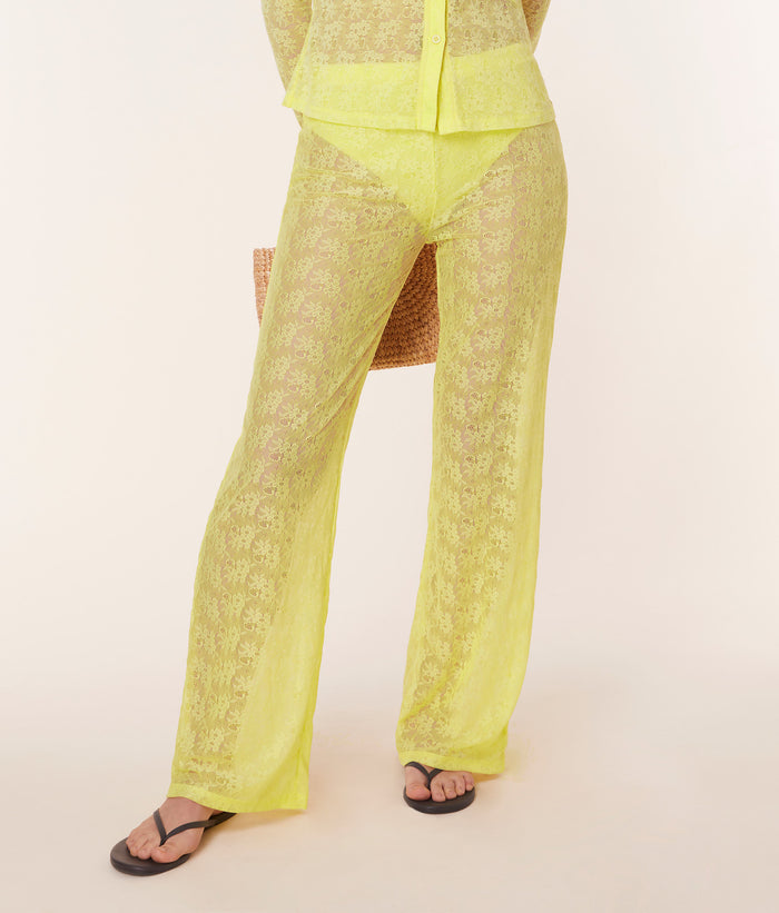 Front view of model wearing the Suva Pant in Limeade by Andie Swim, highlighting the high-rise waist and relaxed fit