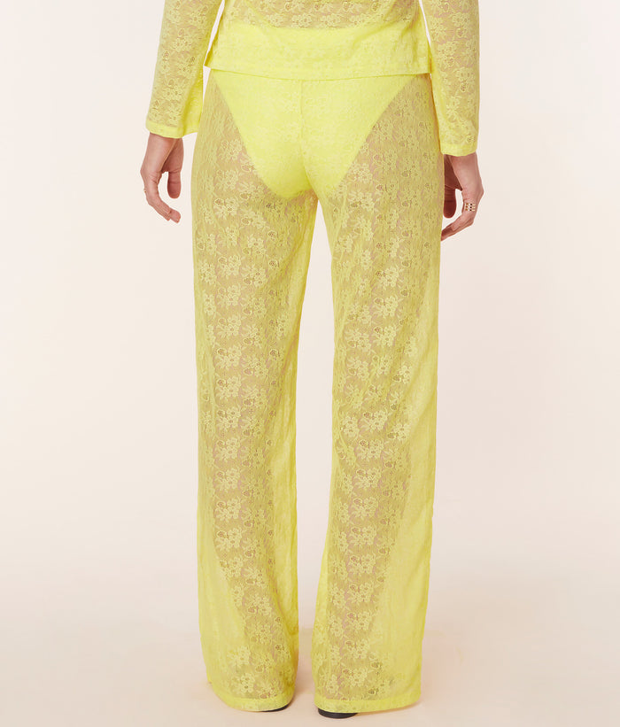 Back view of the Suva Pant in Limeade by Andie Swim, showcasing sheer floral lace fabric and a relaxed leg design.