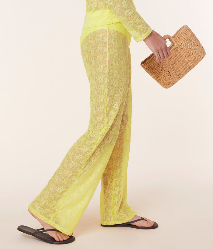 Side view of the Suva Pant by Andie Swim in Limeade, featuring a high-rise waist, relaxed leg fit, and floral lace fabric.