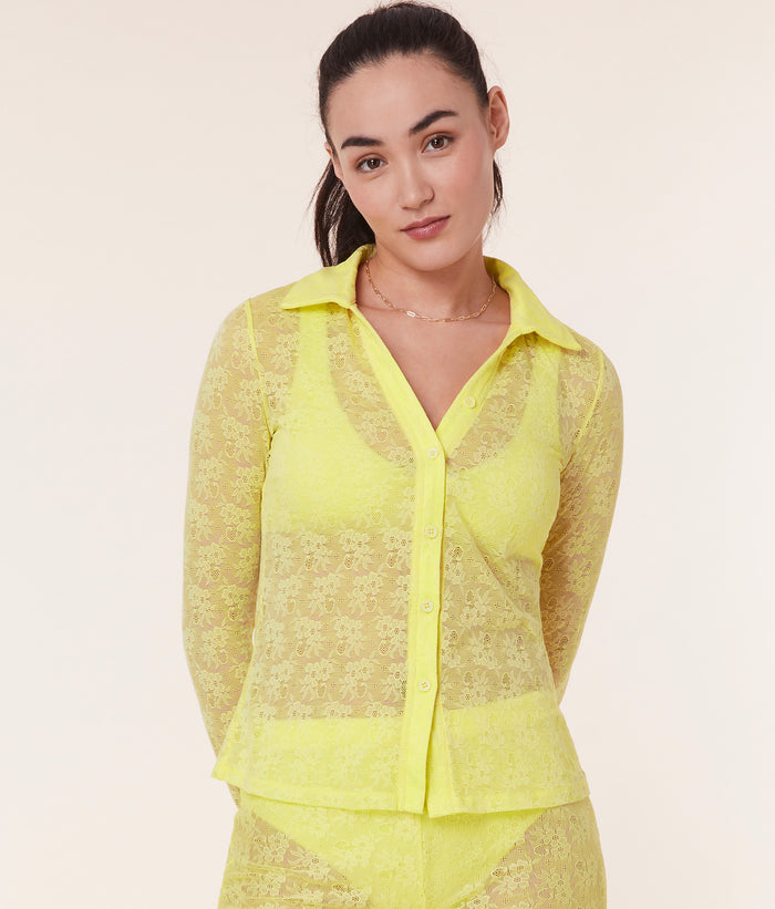 Suva Top by Andie Swim in Limeade, highlighting the sheer lace fabric and collared button-up style