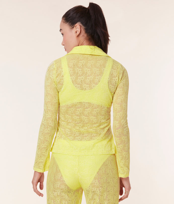 Back view of the Suva Top by Andie Swim in Limeade, highlighting the sheer lace fabric and collared button-up style